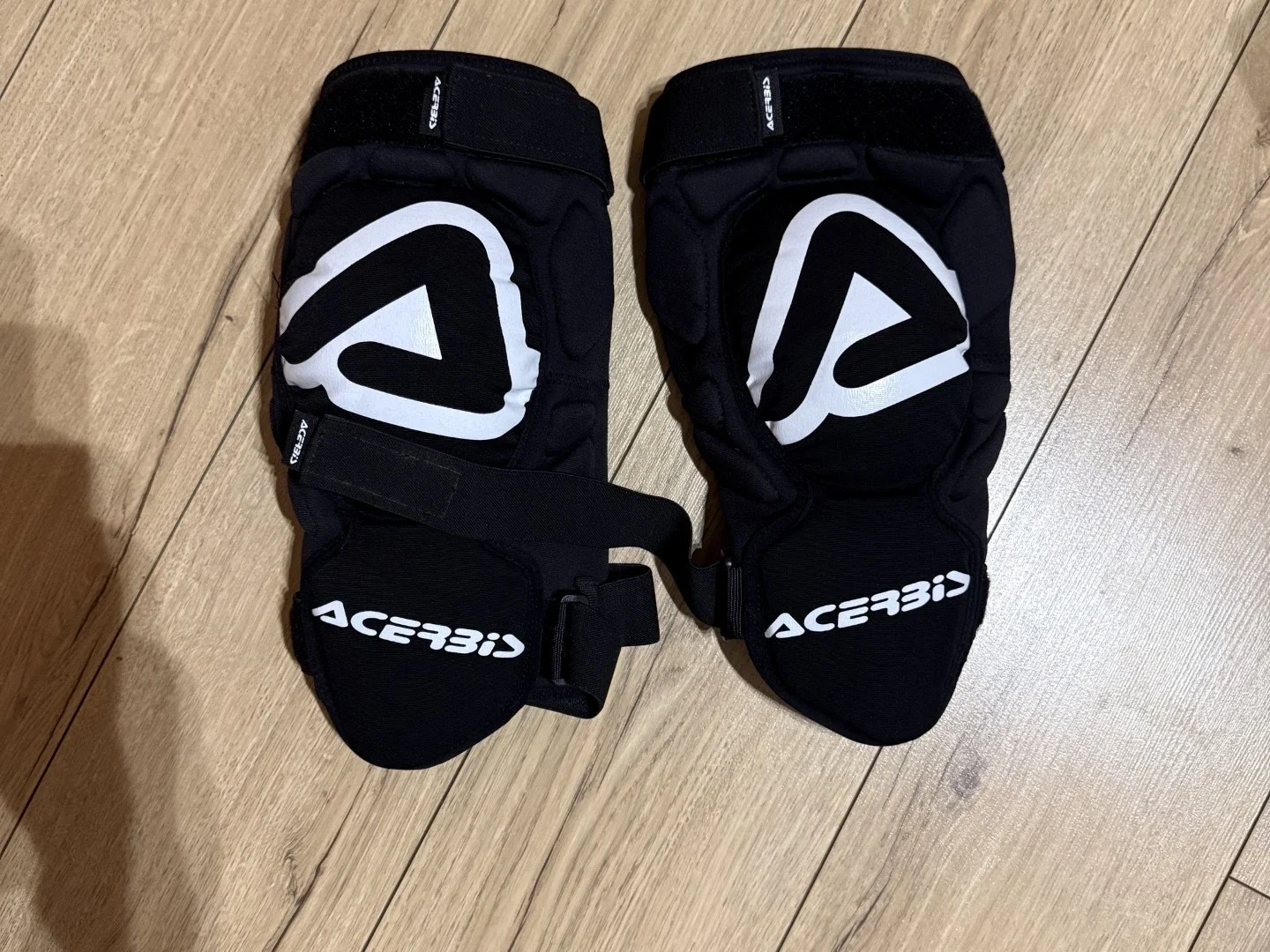 Acerbis soft knee guards front view showing protection panels and adjustable straps