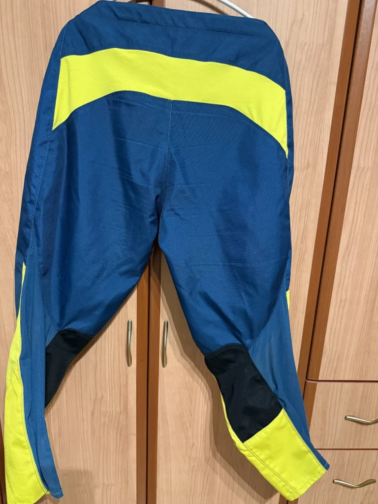 Raven RV Two MX pants blue yellow back view showing rear fit and stretch panels
