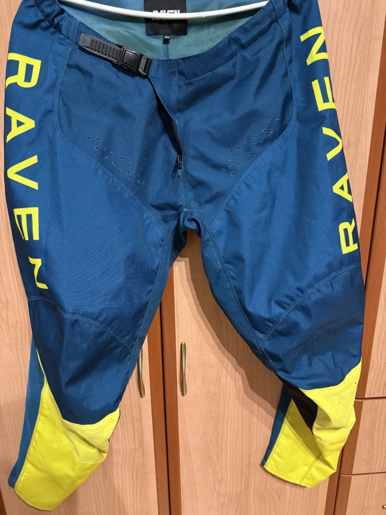 Raven RV Two MX pants blue yellow front view showing ventilation holes and fit